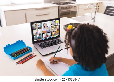 African American Boy Writing Book While Stock Photo 2173363847 ...