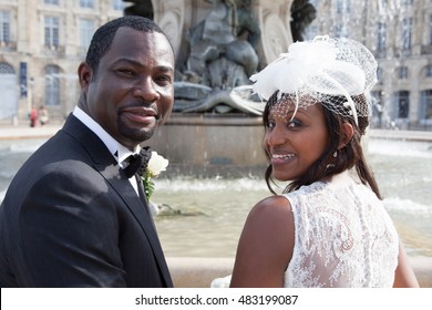 African American Bride And Groom Looking At The Camera