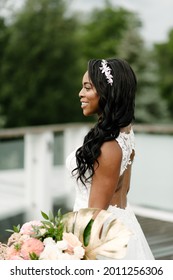 African American Bride In White Dress With Tropical Flowers