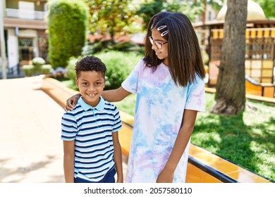 African American Brother And Sister Smiling Happy Outdoors. Black Family Of Two Siblings At The City On A Sunny Day.