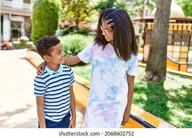 African American Brother And Sister Smiling Happy Outdoors. Black Family Of Two Siblings At The City On A Sunny Day.