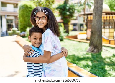 African American Brother And Sister Smiling Happy Outdoors. Black Family Of Two Siblings At The City On A Sunny Day.