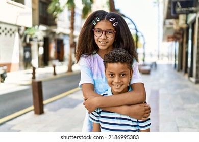 African American Brother And Sister Smiling Happy Outdoors. Black Family Of Two Siblings At The City On A Sunny Day.