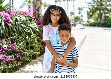 African American Brother And Sister Smiling Happy Outdoors. Black Family Of Two Siblings At The City On A Sunny Day.