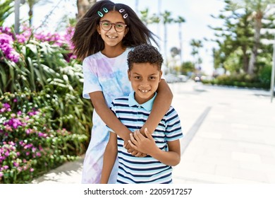 African American Brother And Sister Smiling Happy Outdoors. Black Family Of Two Siblings At The City On A Sunny Day.