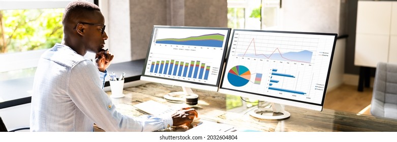 African American Business Desktop Looking At Graphs On Computer - Shutterstock ID 2032604804