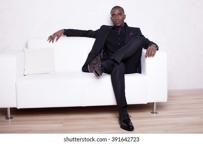 African American Business Man In Black Suit Over White Background