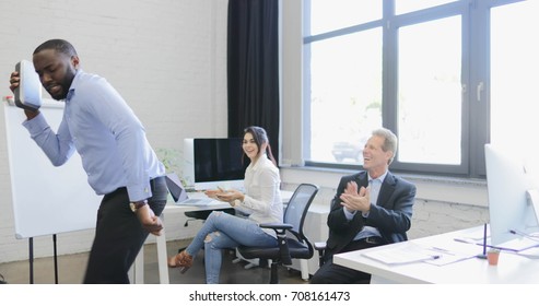 African American Business Man Entertain His Colleagues Dancing In Office, Businesspeople Group Clapping Hands Cheering On Break Slow Motion 60