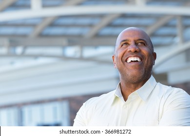 African American Business Man Looking Up And Laughing