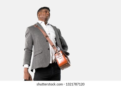 African american business man traveling with suitcases with back pain on isolated grey background