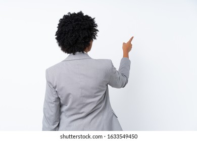 African American Business Woman Over Isolated White Background Pointing Back With The Index Finger