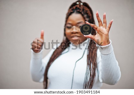 African american business woman show Chainlink coin and thumb up. Cryptocurrency concept.