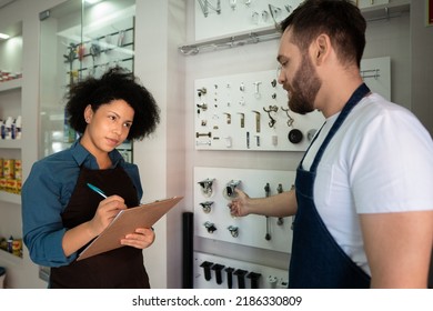 African American Business Woman Talking To Colleague About Sales And Training At Utility Store