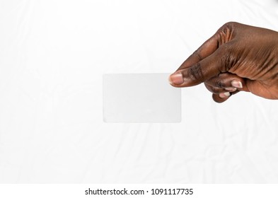 African American Business Woman's Hand Holding A Blank Business Card Or A Ticket/flyer, Isolated On White Background For Advertising Mockup