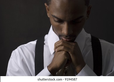 African American businessman is thinking intensely