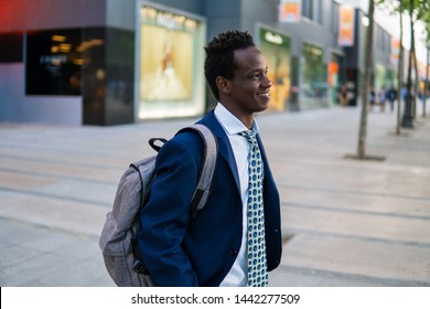 African American Businessman Wearing Blue Suit And Backpack. Business Concept