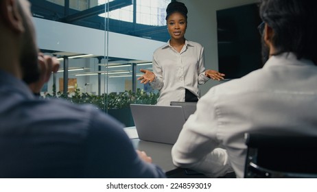 African American businesswoman mentor business coach company CEO female leader teaching business team multiracial diverse coworkers present startup project corporate training studying in office study - Powered by Shutterstock