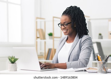 African American Businesswoman Using Laptop In Modern Office. Copy Space