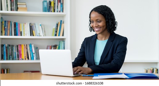 African american businesswoman working at computer at homeoffice to stay at home