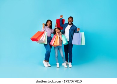 African American Cheerful People Holding Shopping Bags With New Clothes