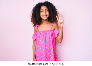 African American Child With Curly Hair Wearing Casual Dress Showing And Pointing Up With Fingers Number Four While Smiling Confident And Happy. 