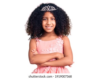 African american child with curly hair wearing princess crown happy face smiling with crossed arms looking at the camera. positive person.  - Powered by Shutterstock