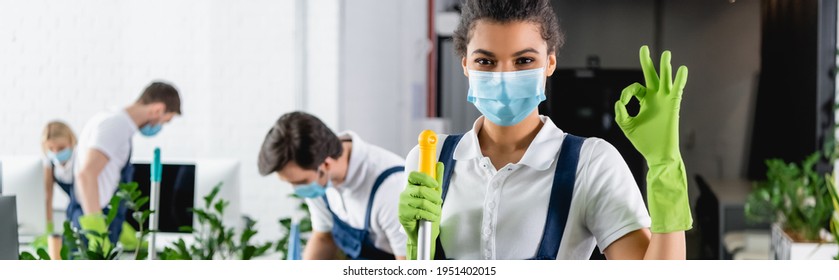 African American Cleaner In Medical Mask Showing Ok Gesture And Holding Mop In Office, Banner