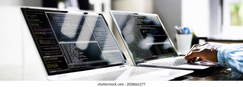 African American Coder Using Computer At Desk. Web Developer