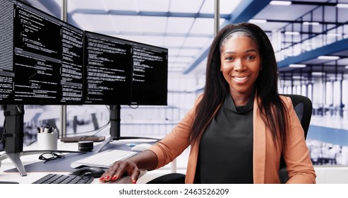 African American Coder Using Computer At Desk. Web Developer