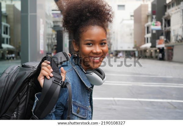 african american college student in city,\
scholarships to study abroad, Happy woman smile portrait, young\
college girl. Scholarship, exchange student urban concept. work and\
travel after\
graduation.