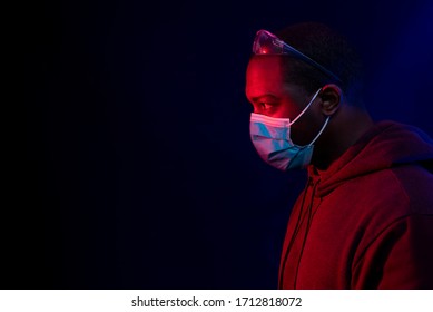 African American Community Is Hit Hard With The Current Coronavirus Pandemic, Conceptual Imagery Of Black Male Wearing Face Mask And Goggles With Look Of Concern 