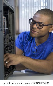 African American Computer Technician Repairing A Computer