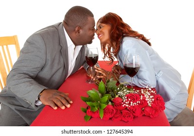 African American Couple About to Kiss in Romantic Dinner