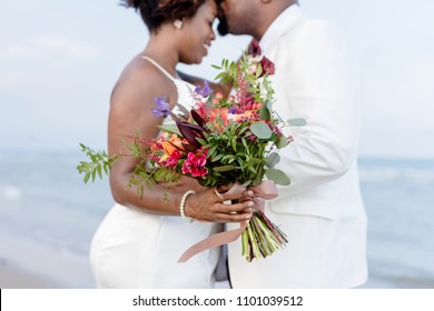 African American couple getting married at the beach - Powered by Shutterstock