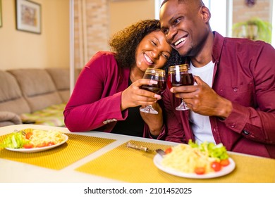 African American Couple In Love Drinking Wine From Glasses And Eating Italian Pasta In Living Room 14 February Valentines Day