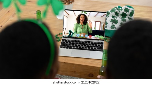 African american couple making st patrick's day video call with female friend on laptop at home. celebrating the irish patron saint's day at home in isolation during quarantine lockdown. - Powered by Shutterstock