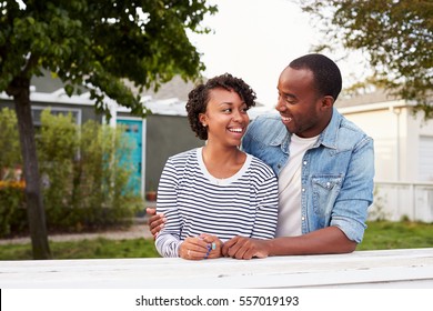 African American Couple Outside Their New House