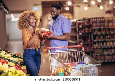 African american couple shopping for healthy fresh food at produce section of supermarket. - Powered by Shutterstock