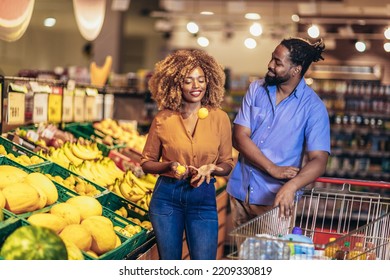 African american couple shopping for healthy fresh food at produce section of supermarket. - Powered by Shutterstock