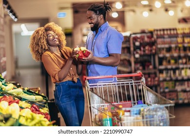 African american couple shopping for healthy fresh food at produce section of supermarket. - Powered by Shutterstock