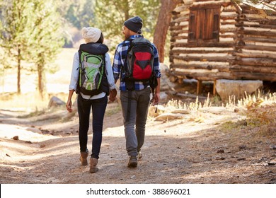 African American Couple Walking Through Fall Woodland