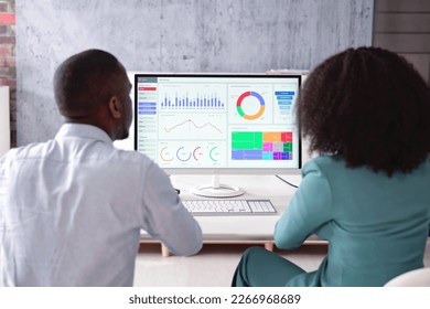 African American Data Analyst Using Data Analytics KPI Dashboard