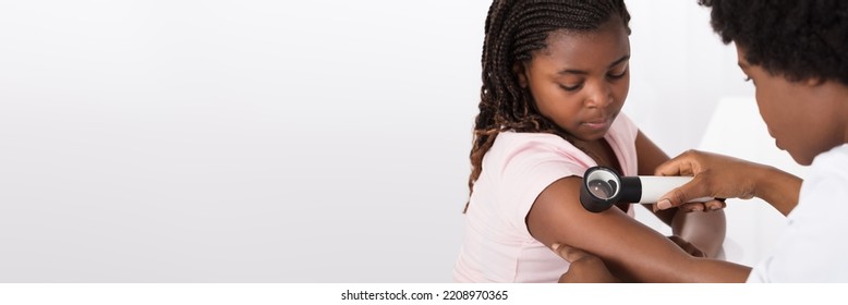 African American Dermatology Consultation. Doctor Checking Child Skin