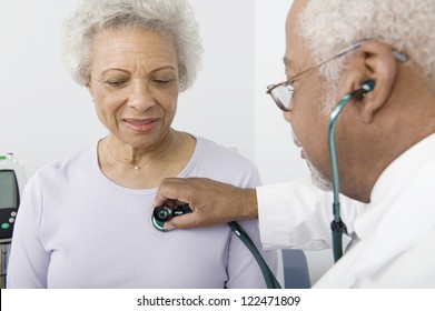 African American Doctor Checking Patient Using Stethoscope