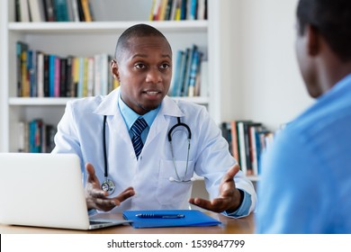 African American Doctor Has Bad News For Male Patient At Hospital