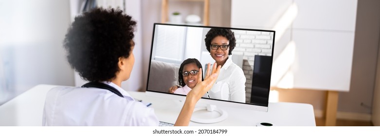 African American Doctor In Telehealth Call With Child Patient
