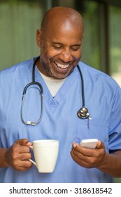 African American Doctor Texting On The Phone.