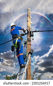 African American Electrician Wearing A Safety Belt Repairing The Line On A Pole