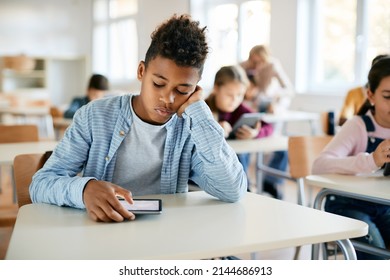 African American Elementary Student E-learning On Touchpad During Computer Class At School.