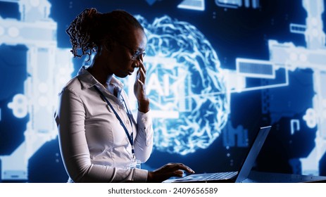 African american engineer develops artificial intelligence neural networks architecture inspired by human brain. Woman with IT expertise setting up AI machine learning algorithms in high tech startup